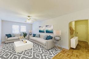 Washington apartment for rent - living area with sofa, coffee table, ceiling fan and view of foyer at  meridian park apartments in washington dc