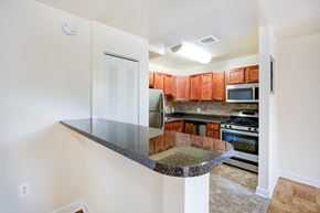 Washington apartment for rent - a kitchen with stainless steel appliances and granite counter tops