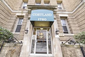 Washington apartment for rent - entrance of cortland apartments with green awning in washington dc