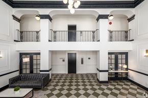 Washington apartment for rent - A black and white checkered floor in a spacious room.