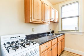 Washington apartment for rent - kitchen with gas range, wood cabinetry and energy efficient appliances at the foreland apartments in washinton dc