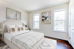 Washington apartment for rent - bedroom with bed, hardwood flooring and large windows at sheridan station south townhomes in washington dc