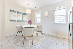 Washington apartment for rent - dining area with table, chairs, windows and tile flooring at sheridan station south townhomes in washington dc
