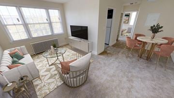 Washington apartment for rent - a living room with a couch and a table and a television