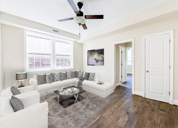 Washington apartment for rent - living area with sofa, coffee table, sitting area, hardwood flooring, and ceiling fan petworth station apartments in washington dc