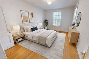 Chevy Chase apartment for rent - A bedroom with a bed, nightstands, and a rug.