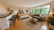 Washington apartment for rent - A living room with a couch, a coffee table, and a fireplace.