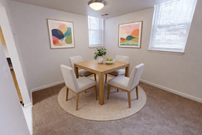 Washington apartment for rent - A dining room with a round table and chairs.