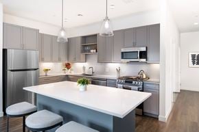 Winchester apartment for rent - A modern kitchen with a large island and stainless steel appliances.
