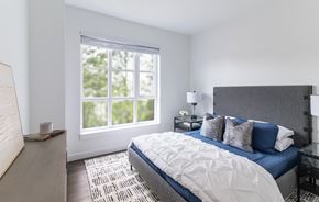 Winchester apartment for rent - A bedroom with a large bed and a window.