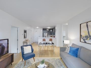 West Roxbury apartment for rent - a living room with a couch and a chair and a dining table