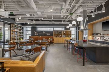 Boston apartment for rent - a restaurant with a bar and tables and chairs and a kitchen