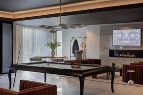 Winchester apartment for rent - A black pool table in a room with a fireplace.