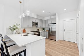 Winchester apartment for rent - A kitchen with a white counter top and a refrigerator.