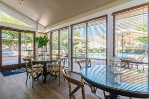 Costa Mesa apartment for rent - A dining room with a glass table and chairs.