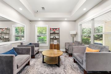 Norcross apartment for rent - A living room with grey couches and a wooden coffee table.