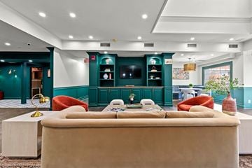 Atlanta apartment for rent - A living room with a beige couch and a white coffee table.