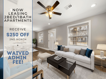 Marietta apartment for rent - A living room with a ceiling fan and a couch with a coffee table in front of it.