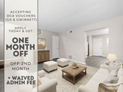 Norcross apartment for rent - A room with a couch, ottoman, and coffee table is on sale for one month off.