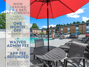 Smyrna apartment for rent - A red umbrella is in the foreground of a pool area with lounge chairs and a sign advertising leasing deals.