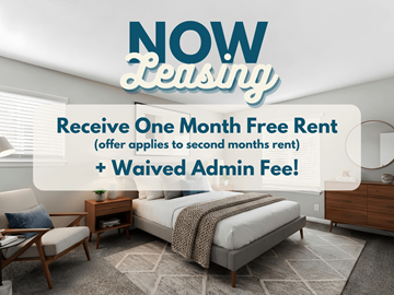 Atlanta apartment for rent - A room with a bed, chair, and table is advertised for leasing with a free first month and waived admin fee.