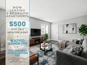 Lawrenceville apartment for rent - A living room with a sign advertising a 2 bedroom apartment for rent at $500 off 2nd month rent.