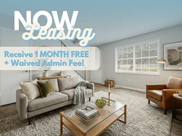 Lawrenceville apartment for rent - A living room with a couch, chair, and coffee table is advertised as "NOW Leasing" with a promotion for 1 month free and waived admin fee.