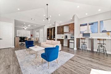 Atlanta apartment for rent - A modern living room with a blue chair and a white couch.