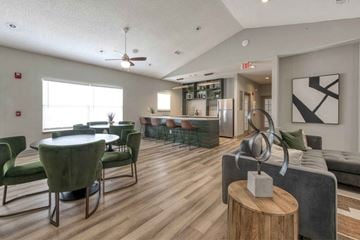 Decatur apartment for rent - A modern living room with a dining table and chairs.