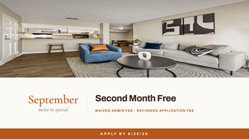 Atlanta apartment for rent - A living room with a couch, chair, and coffee table is advertised as the second month free.