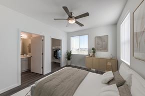 Phoenix apartment for rent - a bedroom with a large bed and a ceiling fan