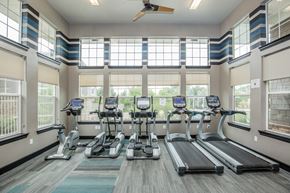 Arvada apartment for rent - A gym with treadmills and exercise bikes.