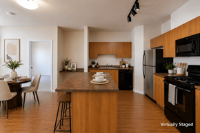 Denver apartment for rent - A kitchen with a dining table and chairs.