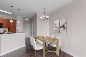 Hendersonville apartment for rent - a dining room with a wooden table and white chairs