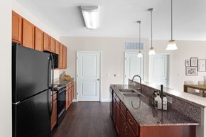 Hendersonville apartment for rent - a kitchen with black appliances and granite counter tops