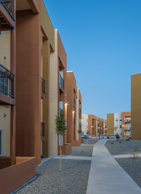Rio Rancho apartment for rent - A long concrete walkway leads between apartment buildings.