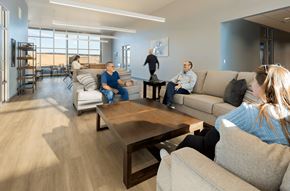 Rio Rancho apartment for rent - A group of people are sitting in the lounge area of the leasing office