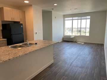 Colorado Springs apartment for rent - A kitchen with a sink and a refrigerator.