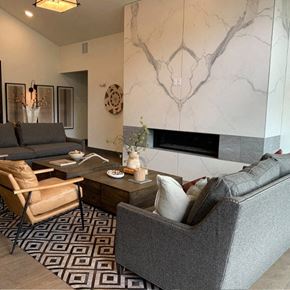 Steamboat Springs apartment for rent - a living room with couches and chairs and a marble wall