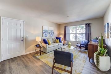 Las Vegas apartment for rent - an open living room with a couch and a table