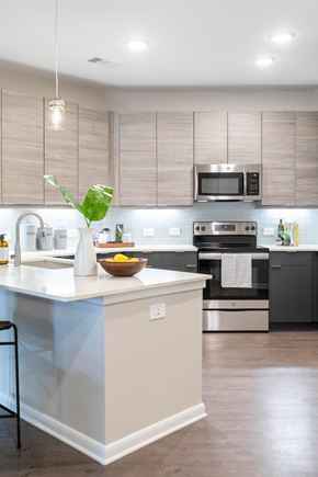 Decatur apartment for rent - A kitchen with a white counter and a bowl of fruit on it.