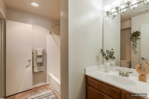 Laurel apartment for rent - A bathroom with a white sink and a mirror.