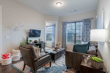 Overland Park apartment for rent - a living room with a couch and a tv