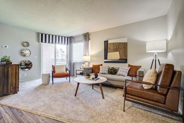 Riverdale apartment for rent - a living room with a couch and a chair and a table