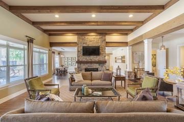 Spring Hill apartment for rent - a living room with couches and chairs and a fireplace