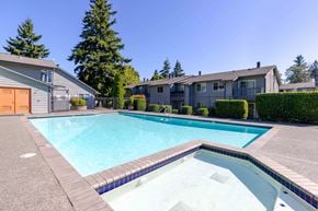 Everett apartment for rent - A swimming pool surrounded by a concrete border.