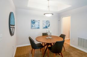 Independence apartment for rent - a dining room with a wooden table and chairs