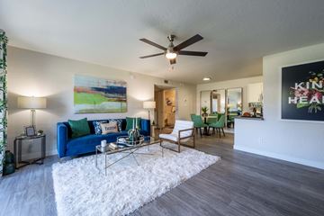 Phoenix apartment for rent - an open living room and dining room with a ceiling fan
