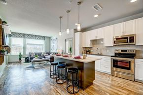 Wheat Ridge apartment for rent - A kitchen with a white oven and white cabinets.