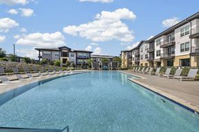Georgetown apartment for rent - A large swimming pool in front of apartment buildings.
